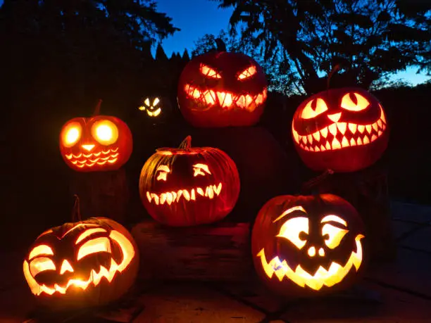 Photo of group of candle lit Halloween Pumpkin