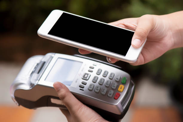 istock Customer use of mobile phone scan to pay 1181241634