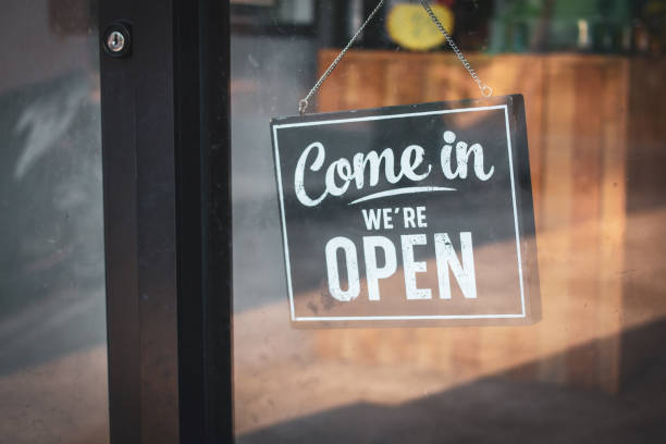 istock A business sign that says 'Come in We're Open'. 1181242073