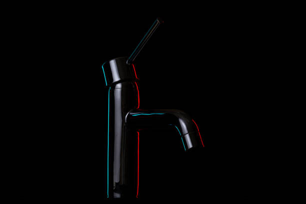Artistic faucet on black background, cold and warm light