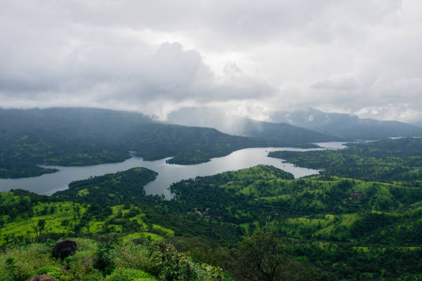 View from the top of a mountain of a river in India View from the top of a mountain of Koyna river in the state of Maharashtra in India village maharashtra stock pictures, royalty-free photos & images