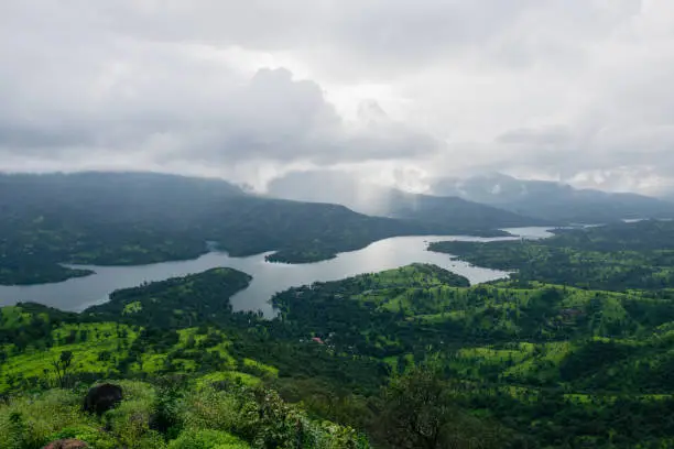 Photo of View from the top of a mountain of a river in India