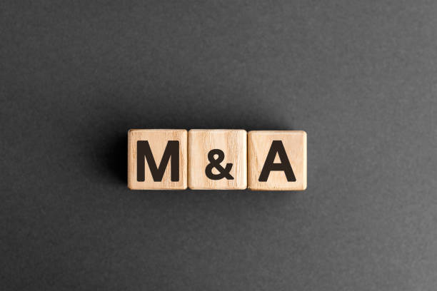 M&A - acronym from wooden blocks with letters stock photo