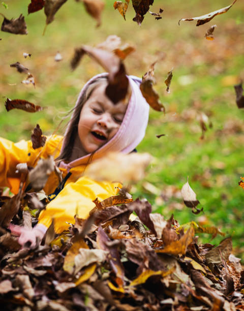 istock Girl Plays in Leaves 1181245274