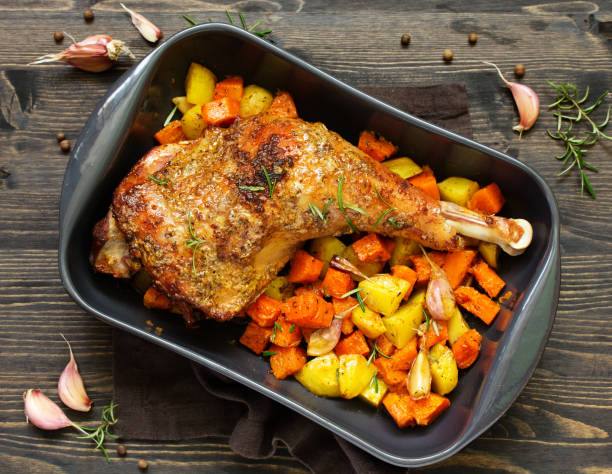 istock baked turkey thigh with vegetables. 1181245545