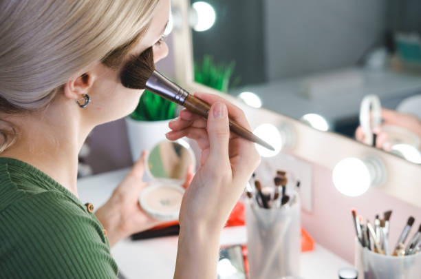 istock Young beautiful woman making make-up 1181247231