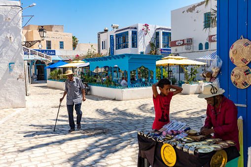 Street shops with clothes in city of Rhodes on Rhodes island, Greece