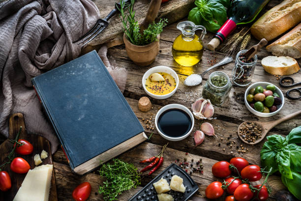 Mediterranean ingredients, spices and cookbook on rustic table