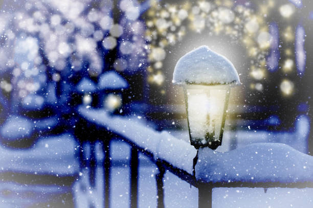 istock luminous lantern at night on a snowdrift,  from a garland 1181250002