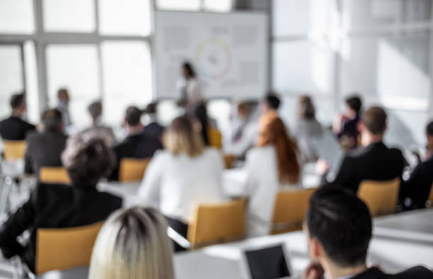 istock Blurred Image of Business People at a Seminar 1181252961
