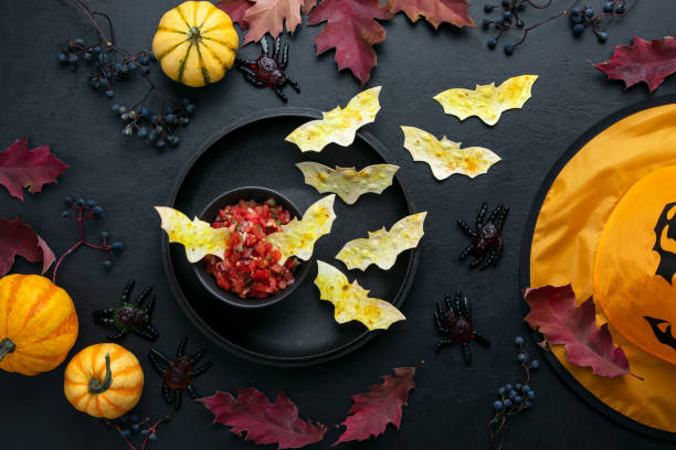 istock Halloween table setting with red salsa and bat tortillas 1181253000