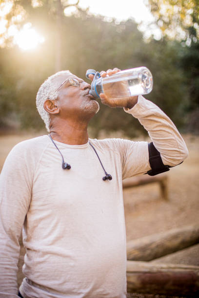 istock Senior Black Man Drinking Water 1181253017