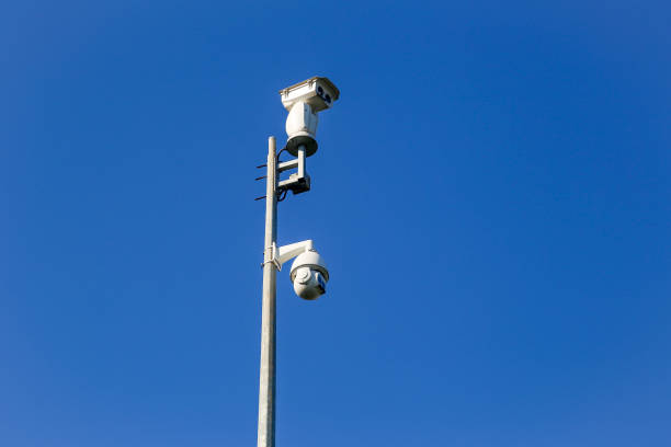 istock Rotating security camera and double lens security camera on street pole 1181254476