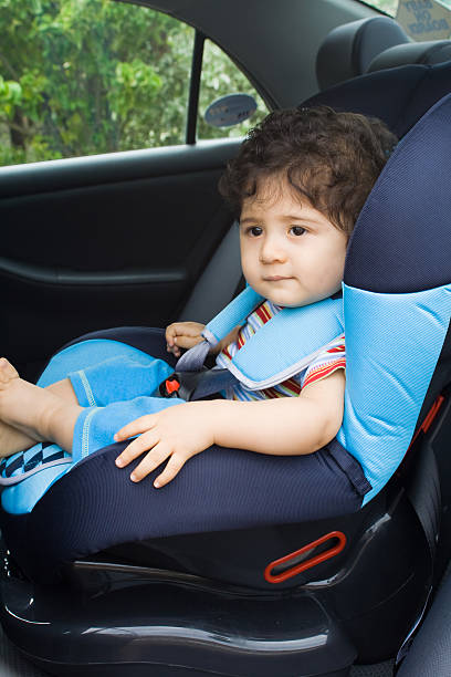 istock toddler boy in safety car seat 118125571