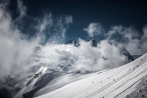 mountain peaks in the clouds in switzerland, europe.