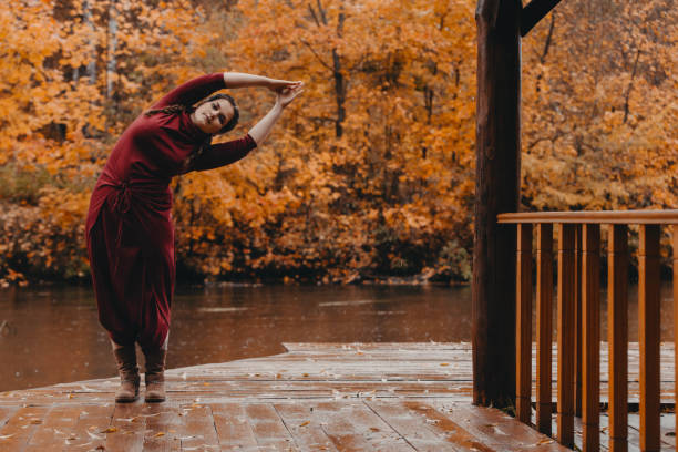istock Curvy girl doing yoga in nature. 1181258799