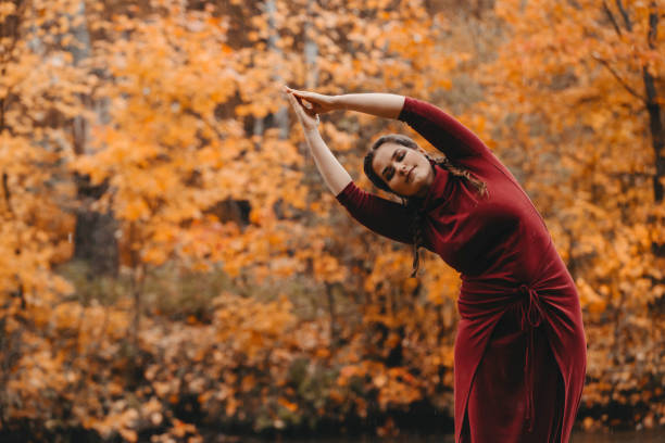 istock Curvy girl doing yoga in nature. 1181258802