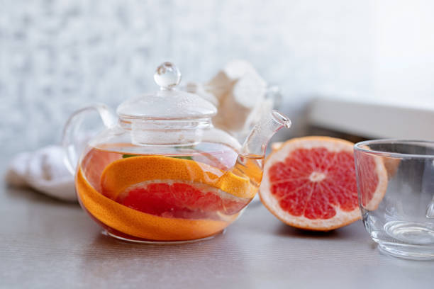 istock Hot grapefruit herbal tea with mint in a glass pot 1181260788