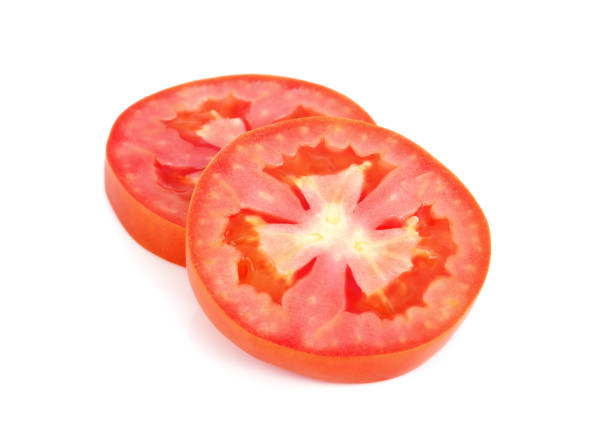 rebanada de tomate aislada sobre fondo blanco - white close up macro cooking fotografías e imágenes de stock