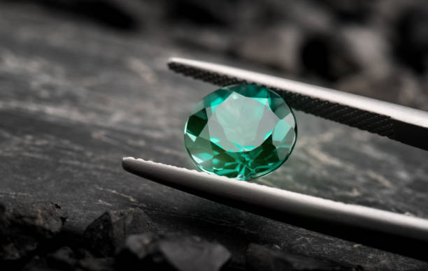 The emerald gemstone jewelry cut. The emerald gemstone jewelry cut with dark stone background. emerald stock pictures, royalty-free photos & images