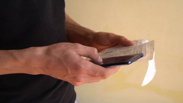 Scanning a QR code from a receipt. Smartphone app for online expense tracking. Budget and Personal Finance App. Frugal living, saving money
