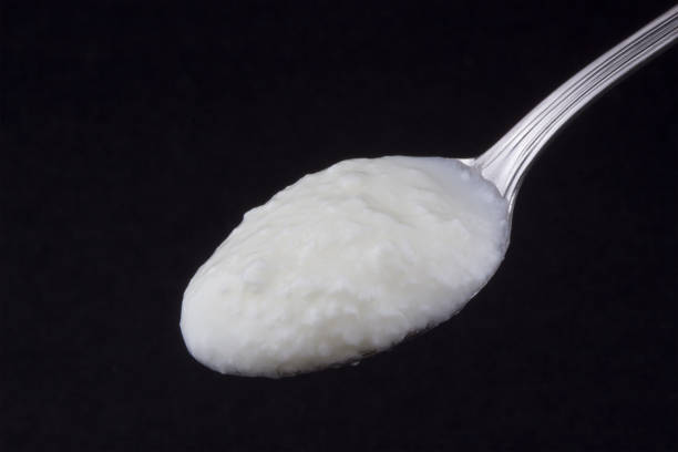 istock Natural yogurt in a spoon 1181265333