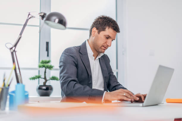 istock Young businessman working at the office 1181265370
