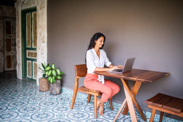 istock Young woman working from home 1181265389