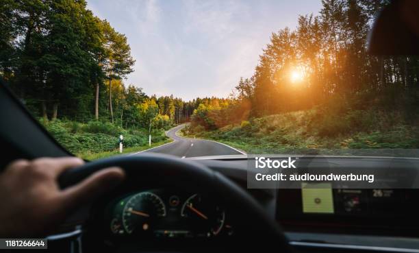 Hands Of Car Driver On Steering Wheel Road Trip Driving On Highway Road Stock Photo - Download Image Now