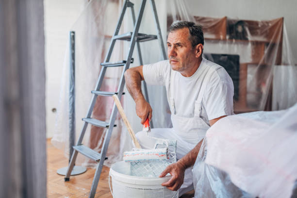 istock Senior man painting 1181266825