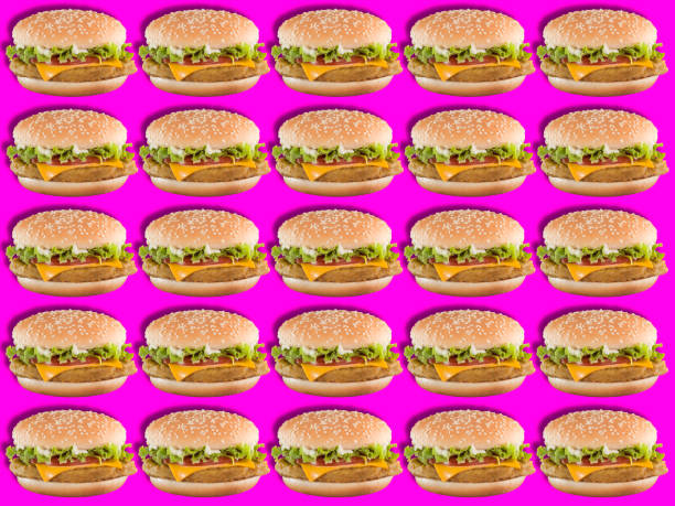 istock Hamburgers on vibrant pink pop art background 1181266846