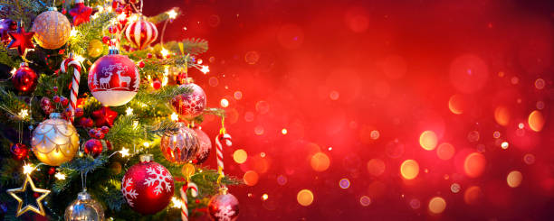 istock Christmas Tree With Ornament And Bokeh Lights In Red Background 1181272261