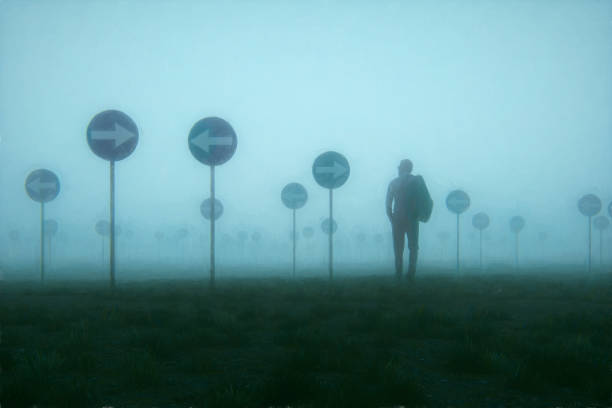 lost and confused businessman walking in meadow - uncertainty imagens e fotografias de stock