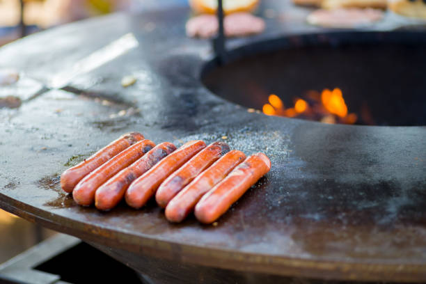 istock sausages are grilled over an open fire 1181272818