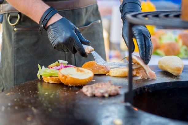 istock cook in gloves cooks grilled burger 1181272840
