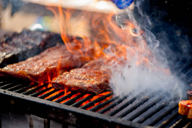 istock BBQ ribs. Ribs fried over an open fire. Fire and smoke roll meat 1181272872