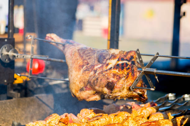 istock BBQ  ham  on a spit over an open fire.Caucasian cuisine 1181273444