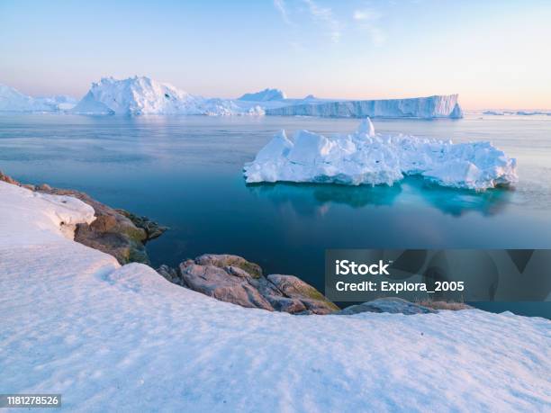Icebergs Are Melting At North Pole In Greenland Stock Photo - Download Image Now - Melting, Greenland, Iceberg - Ice Formation