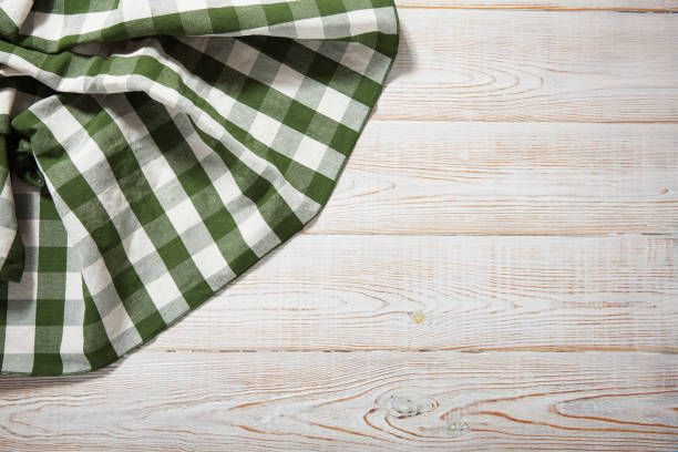 istock Napkin on white wooden table. Mock up for design. Top view. 1181278583