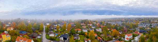 istock In fog. Flying over villa area 1181278944