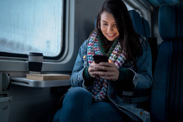 istock Young woman traveling by train 1181281035
