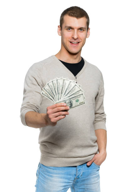 istock Happy student holding money in 100 dollar bills 1181282456