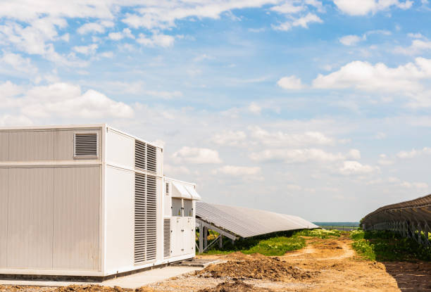 istock Transformer and inverter on solar panels background 1181282816