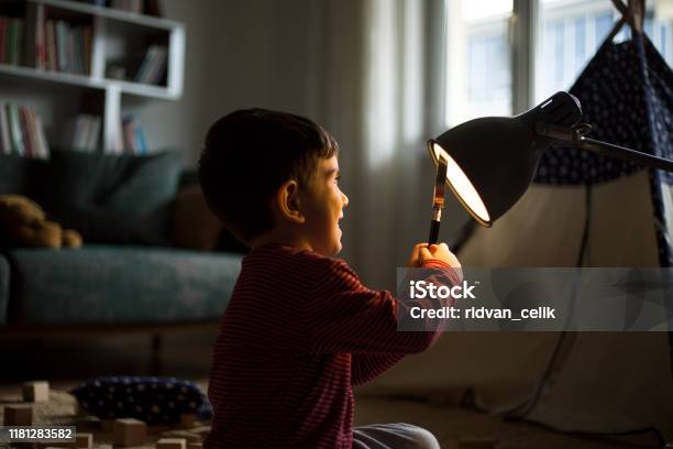 Look At The Light Stock Photo - Download Image Now - Child, Magnifying Glass, Nursery - Bedroom