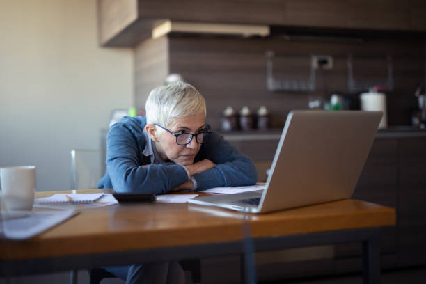 istock Worried senior woman reading an e-mail on tablet 1181284020