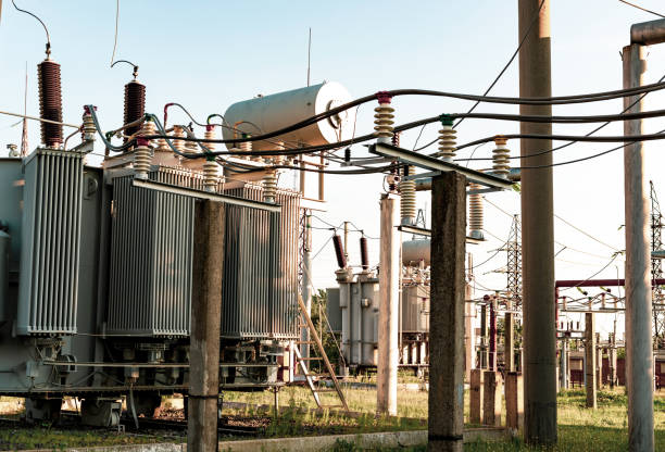 istock High-voltage transformers at Power substations with various equipment 1181284196