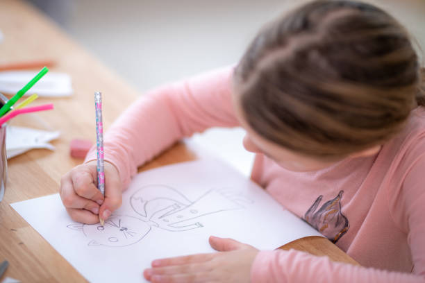 istock Schoolgirl at art class 1181284348