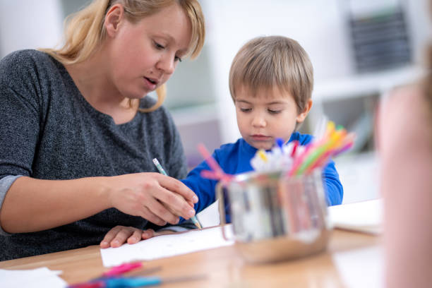 istock Cute little boy drawing 1181284356