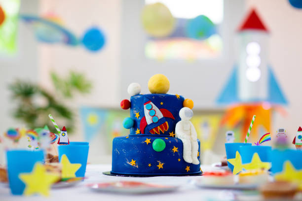 istock Kids space theme birthday party with cake. 1181285956