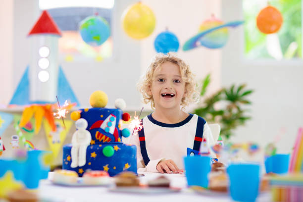 istock Kids space theme birthday party with cake. 1181286039